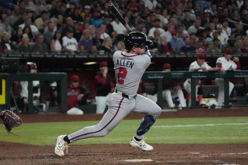 Apr 27, 2025; Phoenix, Arizona, USA; Atlanta Braves shortstop Nick Allen (2) hits an RBI single against the Arizona Diamondbacks in the seventh inning at Chase Field. Mandatory Credit: Rick Scuteri-Imagn Images