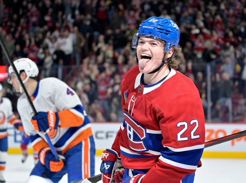 Jan 25, 2024; Montreal, Quebec, CAN; Montreal Canadiens forward Cole Caufield (22) celebrates after scoring a goal against the New York Islanders during the first period at the Bell Centre. Mandatory Credit: Eric Bolte-USA TODAY Sports