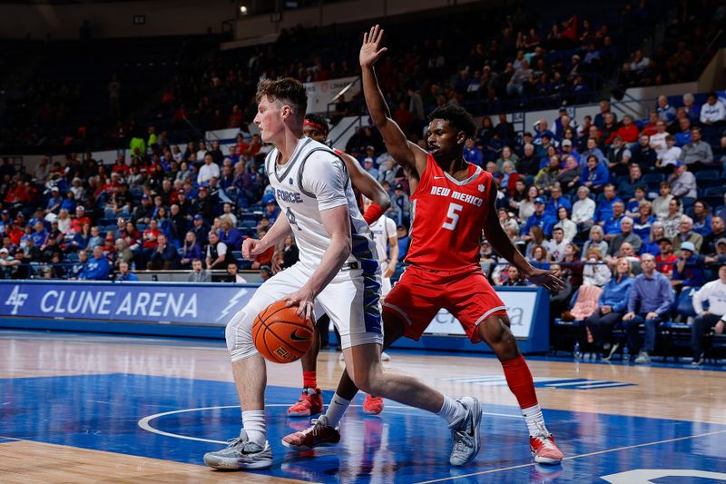 Feb 10, 2023; Colorado Springs, Colorado, USA; Air Force Falcons guard Carter Murphy (4) controls the ball as New Mexico Lobos guard Jamal Mashburn Jr. (5) guards in the second half at Clune Arena. Mandatory Credit: Isaiah J. Downing-USA TODAY Sports