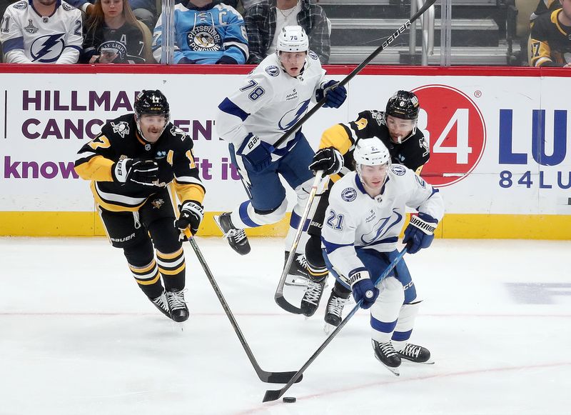 Nov 19, 2024; Pittsburgh, Pennsylvania, USA; Tampa Bay Lightning center Brayden Point (21) skates with the puck against the Pittsburgh Penguins during the second period at PPG Paints Arena. Mandatory Credit: Charles LeClaire-Imagn Images