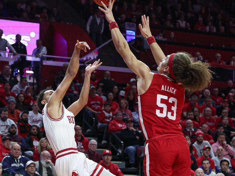 Jan 17, 2024; Piscataway, New Jersey, USA; Nebraska Cornhuskers forward Josiah Allick (53) blocks a shot by Rutgers Scarlet Knights guard Noah Fernandes (2) during the second half at Jersey Mike's Arena. Mandatory Credit: Vincent Carchietta-USA TODAY Sports