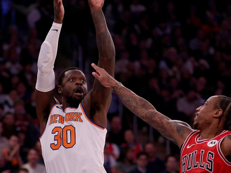 NEW YORK, NEW YORK - JANUARY 03: Julius Randle #30 of the New York Knicks takes a shot as DeMar DeRozan #11 of the Chicago Bulls defends during the first half at Madison Square Garden on January 03, 2024 in New York City. NOTE TO USER: User expressly acknowledges and agrees that, by downloading and or using this photograph, User is consenting to the terms and conditions of the Getty Images License Agreement. (Photo by Elsa/Getty Images)