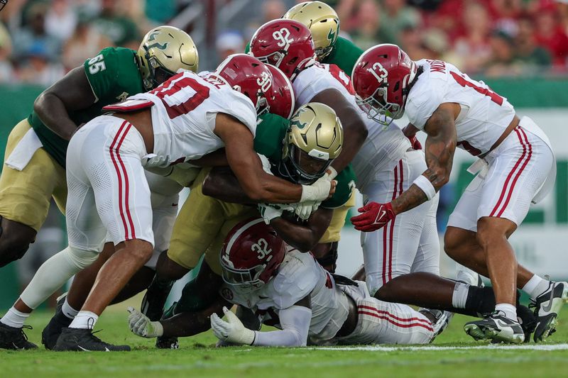 Sep 16, 2023; Tampa, Florida, USA;  South Florida Bulls running back Michel Dukes (2) runs with the ball against the Alabama Crimson Tide in the first quarter at Raymond James Stadium. Mandatory Credit: Nathan Ray Seebeck-USA TODAY Sports