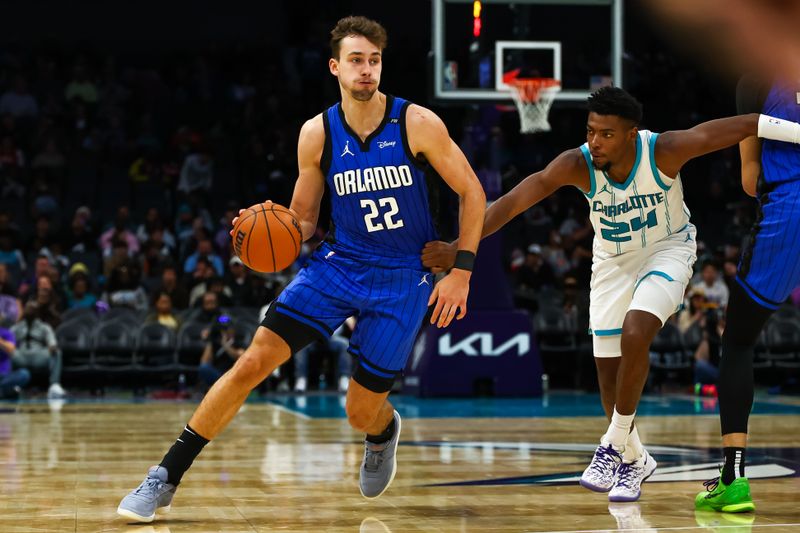 CHARLOTTE, NORTH CAROLINA - NOVEMBER 25: Franz Wagner #22 of the Orlando Magic drives to the basket during the second half of a basketball game .ah at Spectrum Center on November 25, 2024 in Charlotte, North Carolina. NOTE TO USER: User expressly acknowledges and agrees that, by downloading and or using this photograph, User is consenting to the terms and conditions of the Getty Images License Agreement. (Photo by David Jensen/Getty Images)