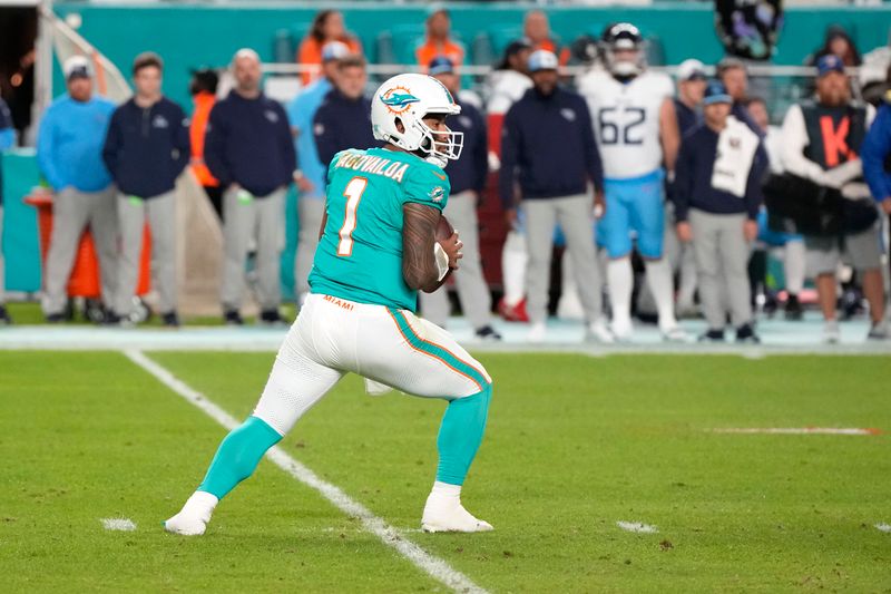 Miami Dolphins quarterback Tua Tagovailoa (1) drops back to pass against the Tennessee Titans during an NFL football game, Monday, Dec. 11, 2023, in Miami Gardens, Fla. (AP Photo/Doug Benc)