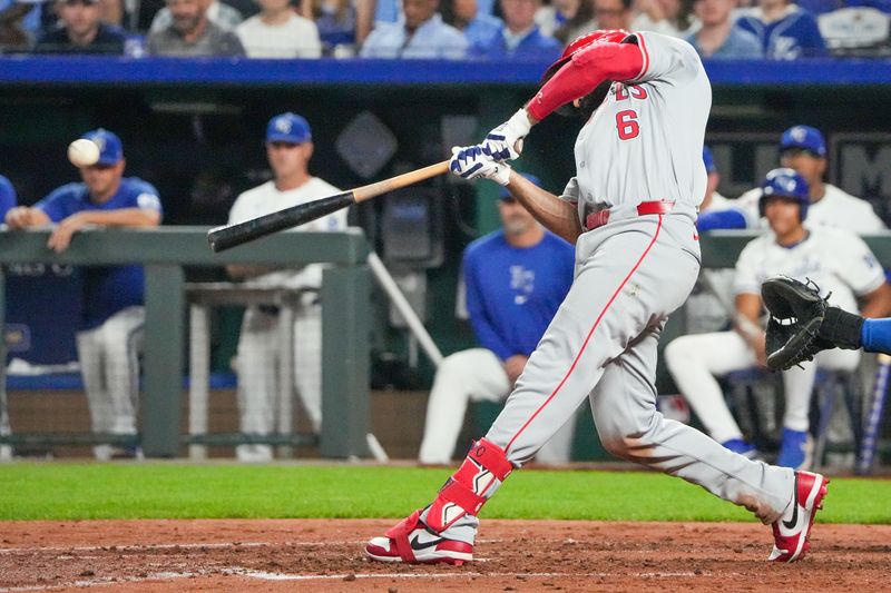 Aug 20, 2024; Kansas City, Missouri, USA; Los Angeles Angels third base Anthony Rendon (6) hits a one-run single against the Kansas City Royals in the sixth inning at Kauffman Stadium. Mandatory Credit: Denny Medley-USA TODAY Sports