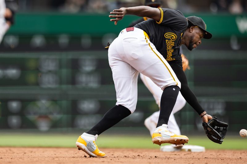 May 5, 2024; Pittsburgh, Pennsylvania, USA; Pittsburgh Pirates shortstop Oneil Cruz (15) fields a ground ball for the second out of the sixth inning against the Colorado Rockies at PNC Park. Mandatory Credit: Scott Galvin-USA TODAY Sports