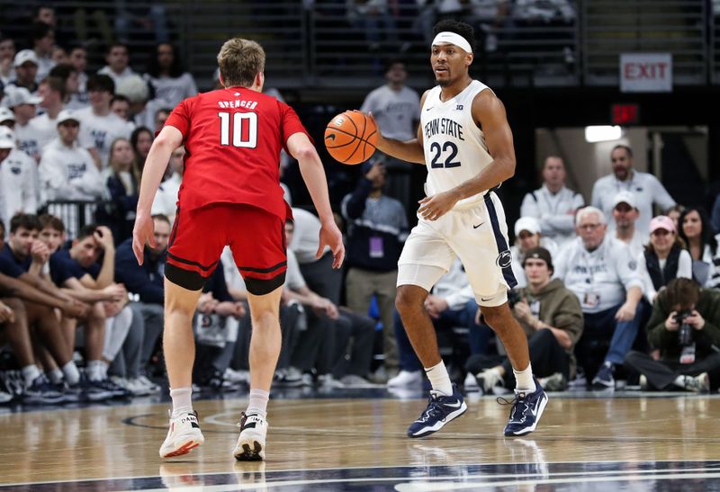 Feb 26, 2023; University Park, Pennsylvania, USA; Penn State Nittany Lions guard Jalen Pickett (22) dribbles the ball as Rutgers Scarlet Knights guard Cam Spencer (10) defends during the first half at Bryce Jordan Center. Mandatory Credit: Matthew OHaren-USA TODAY Sports