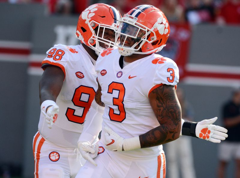 Sep 25, 2021; Raleigh, North Carolina, USA;Clemson Tigers defensive end Xavier Thomas (3) reacts after a sack during the first half against the North Carolina State Wolfpack at Carter-Finley Stadium. Mandatory Credit: Rob Kinnan-USA TODAY Sports