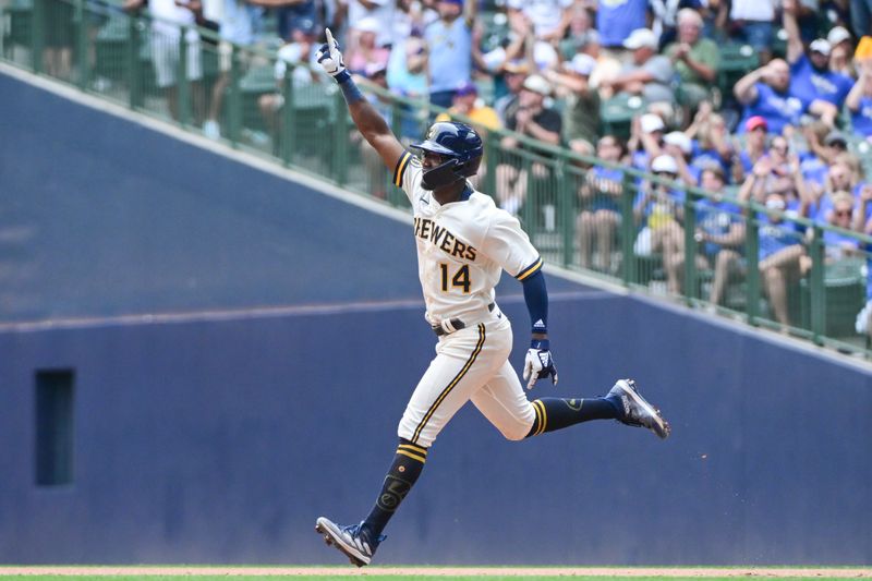 Aug 9, 2023; Milwaukee, Wisconsin, USA; Milwaukee Brewers third baseman Andruw Monasterio (14) reacts after hitting a solo home run against the Colorado Rockies in the fifth inning at American Family Field. Mandatory Credit: Benny Sieu-USA TODAY Sports