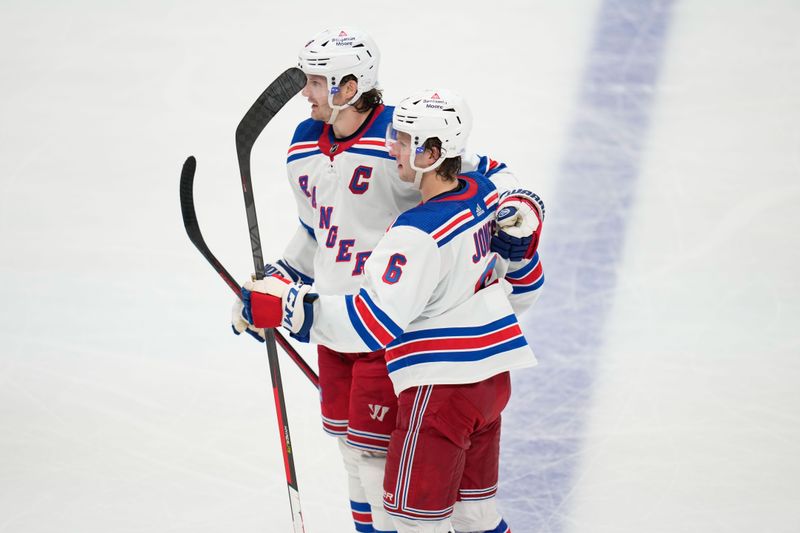 Oct 29, 2022; Dallas, Texas, USA;  New York Rangers defenseman Jacob Trouba (8) and defenseman Zac Jones (6) celebrate after a goal against the Dallas Stars during the third period at American Airlines Center. Mandatory Credit: Chris Jones-USA TODAY Sports