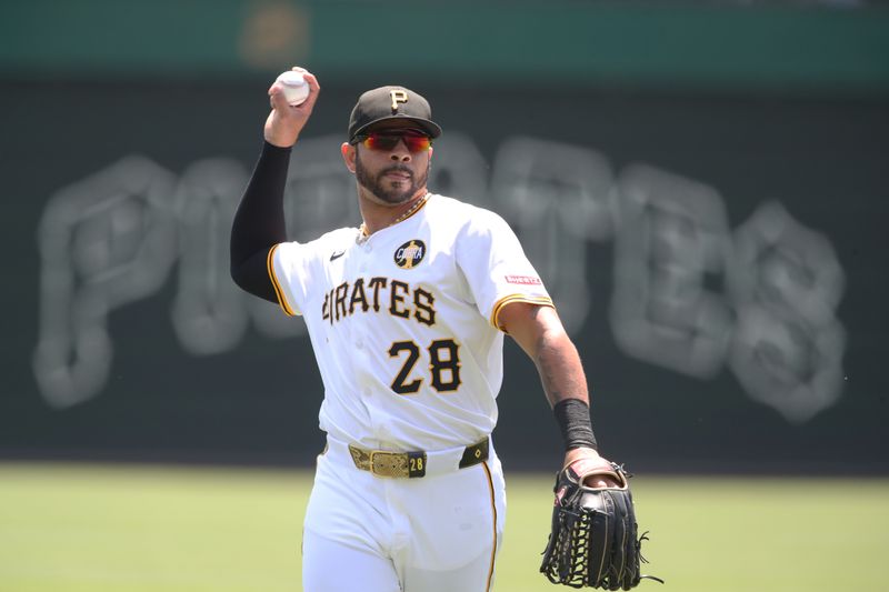 Aug 10, 2025; Pittsburgh, Pennsylvania, USA;  Pittsburgh Pirates left fielder Tommy Pham (28) warms up before the game against the Cincinnati Reds at PNC Park. Mandatory Credit: Charles LeClaire-Imagn Images