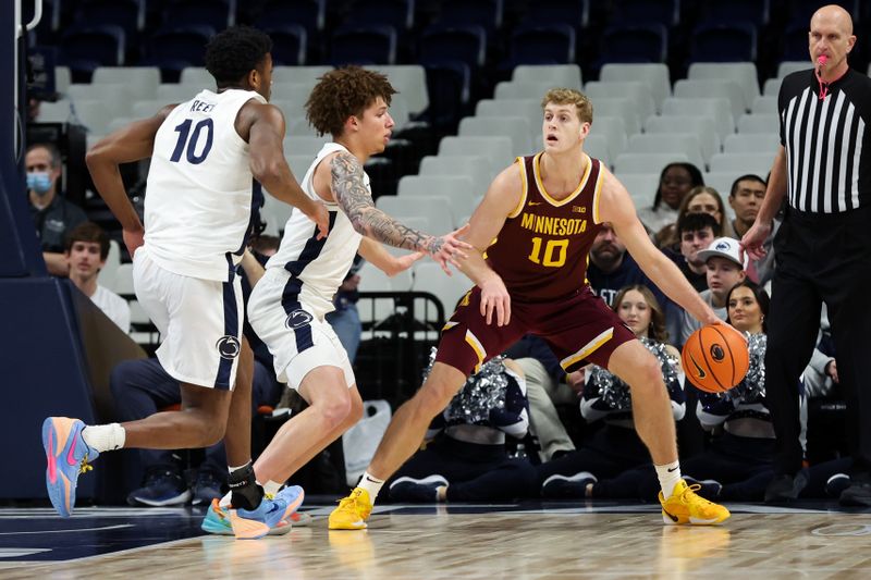 Feb 1, 2026; University Park, Pennsylvania, USA; Minnesota Golden Gophers guard/forward Cade Tyson (10) looks to pass the ball as Penn State Nittany Lions guard Dominick Stewart (7) and forward Josh Reed (10) defend during the first half at Bryce Jordan Center. Mandatory Credit: Matthew O'Haren-Imagn Images