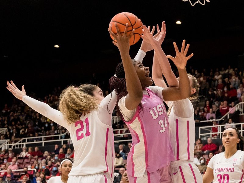 Feb 17, 2023; Stanford, California, USA;  Stanford Cardinal forward Brooke Demetre (21) defends USC Trojans center Clarice Akunwafo (34) during the second half at Maples Pavilion. Mandatory Credit: John Hefti-USA TODAY Sports