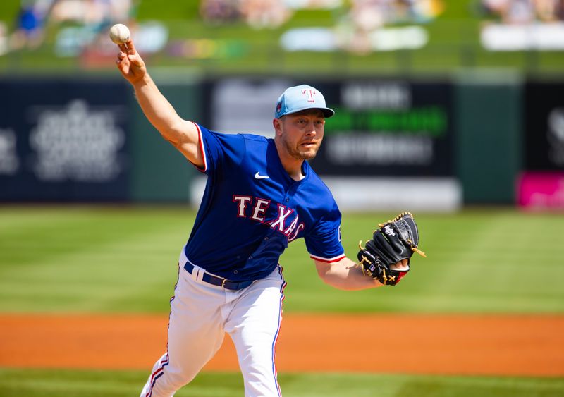 Mar 18, 2024; Surprise, Arizona, USA; Texas Rangers pitcher Adrian Sampson against the Seattle Mariners during a spring training baseball game at Surprise Stadium. Mandatory Credit: Mark J. Rebilas-USA TODAY Sports