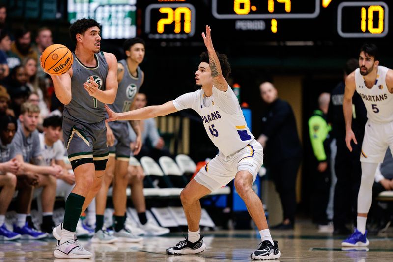 Feb 9, 2024; Fort Collins, Colorado, USA; Colorado State Rams forward Joel Scott (1) controls the ball as San Jose State Spartans forward Trey Anderson (15) guards in the first half at Moby Arena. Mandatory Credit: Isaiah J. Downing-USA TODAY Sports