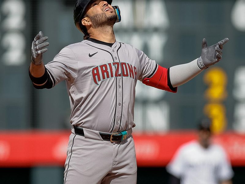 Apr 10, 2024; Denver, Colorado, USA; Arizona Diamondbacks third baseman Eugenio Suarez (28) reacts from second on a two RBI double in the ninth inning against the Colorado Rockies at Coors Field. Mandatory Credit: Isaiah J. Downing-USA TODAY Sports