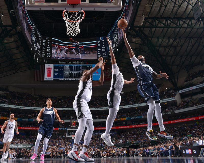 DALLAS, TX - OCTOBER 24: Naji Marshall #13 of the Dallas Mavericks drives to the basket during the game against the San Antonio Spurs on October 24, 2024 at the American Airlines Center in Dallas, Texas. NOTE TO USER: User expressly acknowledges and agrees that, by downloading and or using this photograph, User is consenting to the terms and conditions of the Getty Images License Agreement. Mandatory Copyright Notice: Copyright 2024 NBAE (Photo by Glenn James/NBAE via Getty Images)