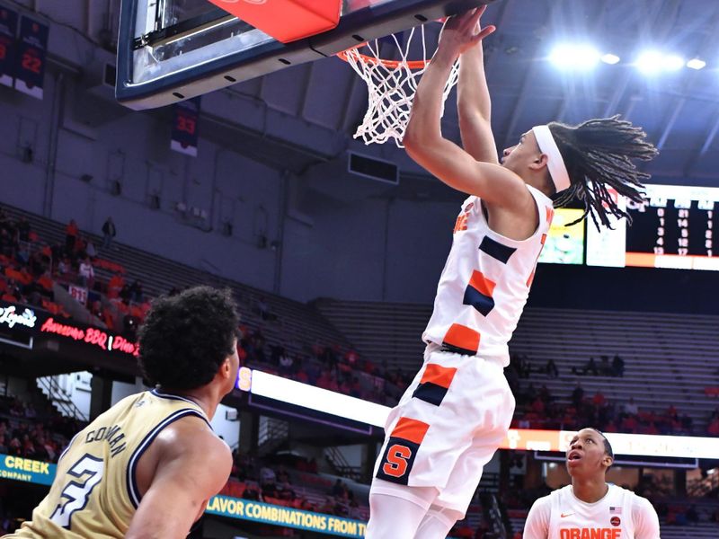 Feb 28, 2023; Syracuse, New York, USA; Syracuse Orange forward Benny Williams (13) dunks the ball as guard Quadir Copeland (24) and Georgia Tech Yellow Jackets guard Dallan Coleman (3) look on in the second half at the JMA Wireless Dome. Mandatory Credit: Mark Konezny-USA TODAY Sports