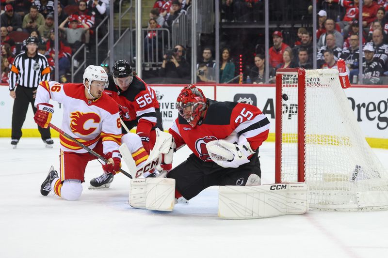 Mar 20, 2025; Newark, New Jersey, USA; Calgary Flames defenseman Daniil Miromanov (62) (not pictured) scores a goal on New Jersey Devils goaltender Jacob Markstrom (25) during the third period at Prudential Center. Mandatory Credit: Ed Mulholland-Imagn Images