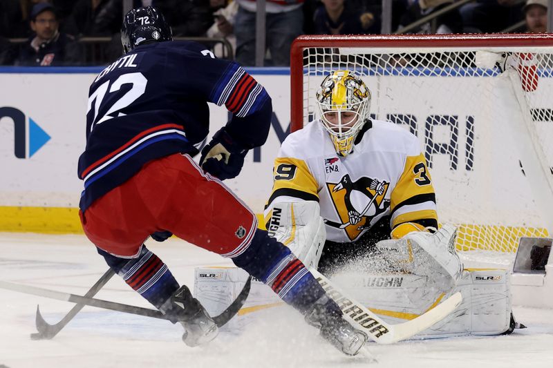 Dec 6, 2024; New York, New York, USA; Pittsburgh Penguins goaltender Alex Nedeljkovic (39) makes a save against New York Rangers center Filip Chytil (72) during the first period at Madison Square Garden. Mandatory Credit: Brad Penner-Imagn Images