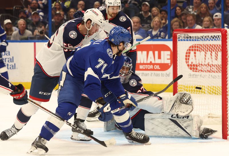 Apr 9, 2024; Tampa, Florida, USA; Tampa Bay Lightning center Anthony Cirelli (71) shoots and scores a goal on Columbus Blue Jackets goaltender Jet Greaves (73) during the third period at Amalie Arena. Mandatory Credit: Kim Klement Neitzel-USA TODAY Sports