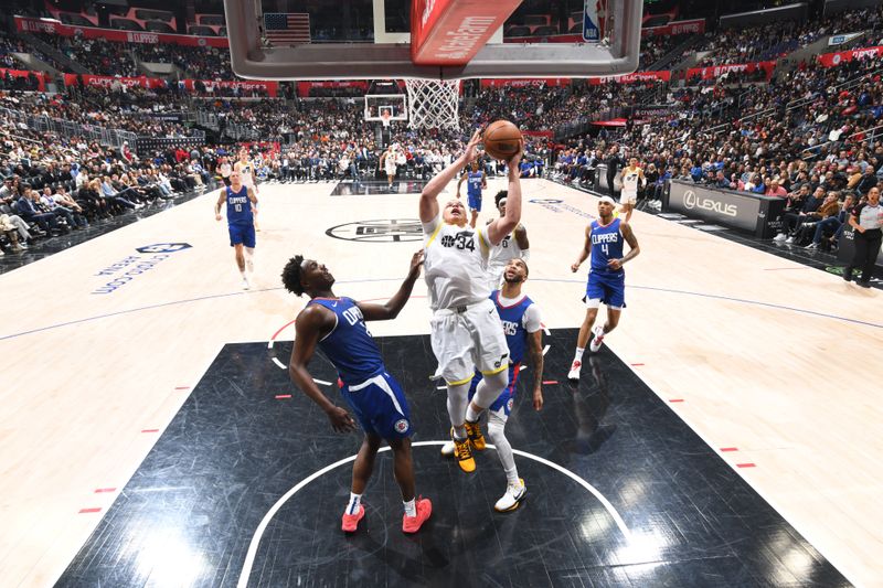 LOS ANGELES, CA - APRIL 12: Kenny Lofton Jr. #34 of the Utah Jazz drives to the basket during the game against the LA Clippers on April 12, 2024 at Crypto.Com Arena in Los Angeles, California. NOTE TO USER: User expressly acknowledges and agrees that, by downloading and/or using this Photograph, user is consenting to the terms and conditions of the Getty Images License Agreement. Mandatory Copyright Notice: Copyright 2024 NBAE (Photo by Adam Pantozzi/NBAE via Getty Images)
