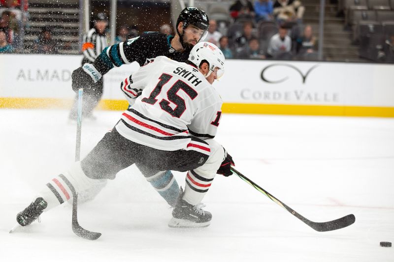 Oct 31, 2024; San Jose, California, USA; San Jose Sharks defenseman Jake Walman (96) and Chicago Blackhawks center Craig Smith (15) vie for a loose puck during the first period at SAP Center at San Jose. Mandatory Credit: D. Ross Cameron-Imagn Images