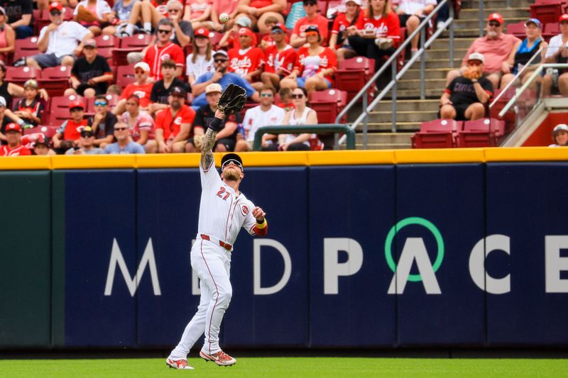 Sep 22, 2024; Cincinnati, Ohio, USA; Cincinnati Reds outfielder Jake Fraley (27) catches a fly out hit by Pittsburgh Pirates catcher Joey Bart (not pictured) in the third inning at Great American Ball Park. Mandatory Credit: Katie Stratman-Imagn Images