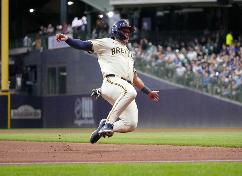 May 6, 2025; Milwaukee, Wisconsin, USA; Milwaukee Brewers outfielder Isaac Collins (6) runs and slides into third base safely against the Houston Astros in the fourth inning at American Family Field. Mandatory Credit: Michael McLoone-Imagn Images