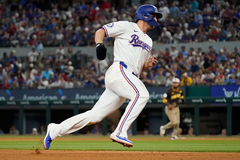 Jul 4, 2024; Arlington, Texas, USA; Texas Rangers shortstop Corey Seager (5) runs the bases to score during the sixth inning against the San Diego Padres at Globe Life Field. Mandatory Credit: Raymond Carlin III-USA TODAY Sports