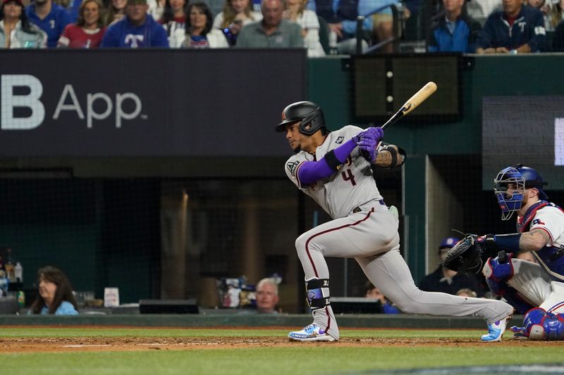 Oct 28, 2023; Arlington, TX, USA; Arizona Diamondbacks second baseman Ketel Marte (4) hits a single in the eighth inning against the Texas Rangers in game two of the 2023 World Series at Globe Life Field. Mandatory Credit: Raymond Carlin III-USA TODAY Sports