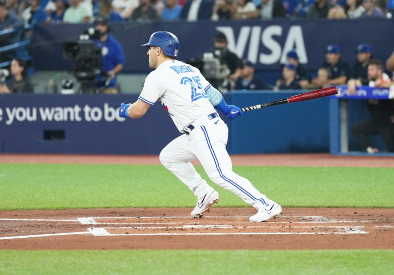 Jun 28, 2023; Toronto, Ontario, CAN; Toronto Blue Jays center fielder Daulton Varsho (25) hits an RBI double against the San Francisco Giants during the first inning at Rogers Centre. Mandatory Credit: Nick Turchiaro-USA TODAY Sports