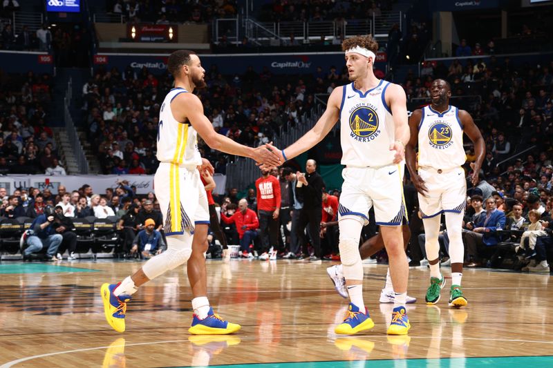 WASHINGTON, DC -? FEBRUARY 27: Stephen Curry #30 of the Golden State Warriors high fives Brandin Podziemski #2 of the Golden State Warriors during the game against the Washington Wizards on February 27, 2024 at Capital One Arena in Washington, DC. NOTE TO USER: User expressly acknowledges and agrees that, by downloading and or using this Photograph, user is consenting to the terms and conditions of the Getty Images License Agreement. Mandatory Copyright Notice: Copyright 2024 NBAE (Photo by Kenny Giarla/NBAE via Getty Images)