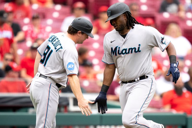 Aug 9, 2023; Cincinnati, OH, USA; Miami Marlins first baseman Josh Bell (9) greets Miami Marlins quality assurance coach Griffin Benedict (81) after hitting a solo home run in the fourth inning of the MLB baseball game between Cincinnati Reds and Miami Marlins at Great American Ball Park in Cincinnati on Wednesday, Aug. 9, 2023.  Mandatory Credit: Albert Cesare-USA TODAY Sports