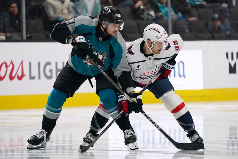 Dec 3, 2025; San Jose, California, USA;  San Jose Sharks left wing Pavol Regenda (84) and Washington Capitals center Ethen Frank (53) prepare for the faceoff in the third period at SAP Center at San Jose. Mandatory Credit: David Gonzales-Imagn Images