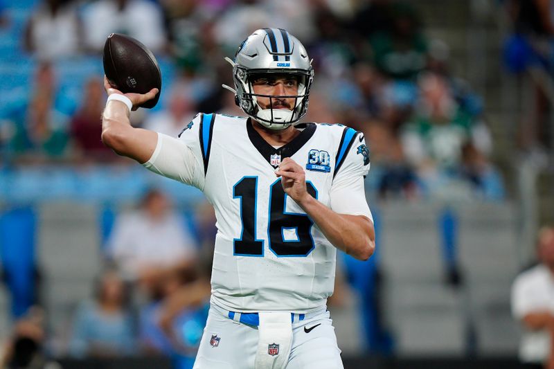 Carolina Panthers quarterback Jack Plummer (16) passes against the New York Jets during the first half of a preseason NFL football game, Saturday, Aug. 17, 2024, in Charlotte, N.C. (AP Photo/Jacob Kupferman)