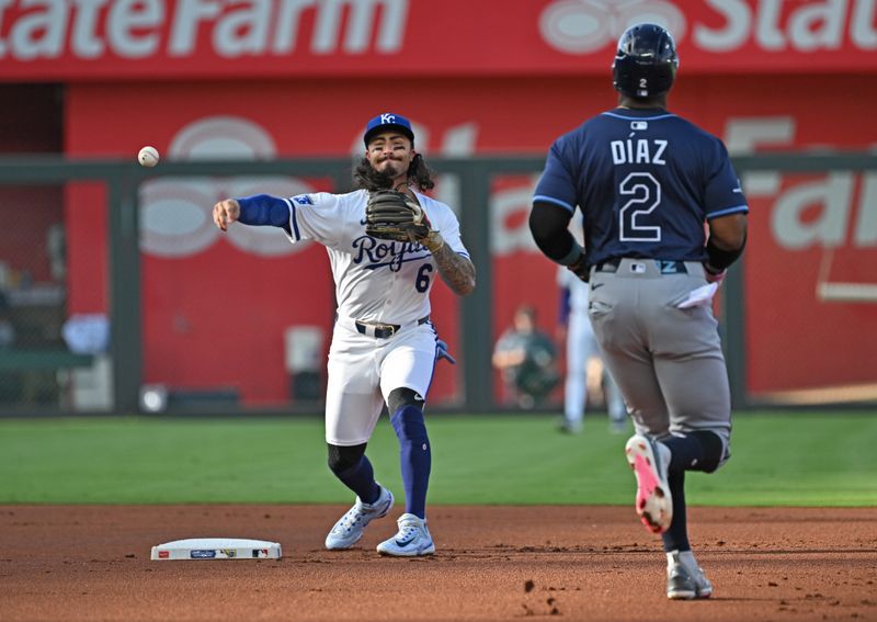 Jun 24, 2025; Kansas City, Missouri, USA;  Kansas City Royals second baseman Jonathan India (6) throws to first base for a double play against Tampa Bay Rays first baseman Yandy Diaz (2) in the first inning at Kauffman Stadium. Mandatory Credit: Peter Aiken-Imagn Images