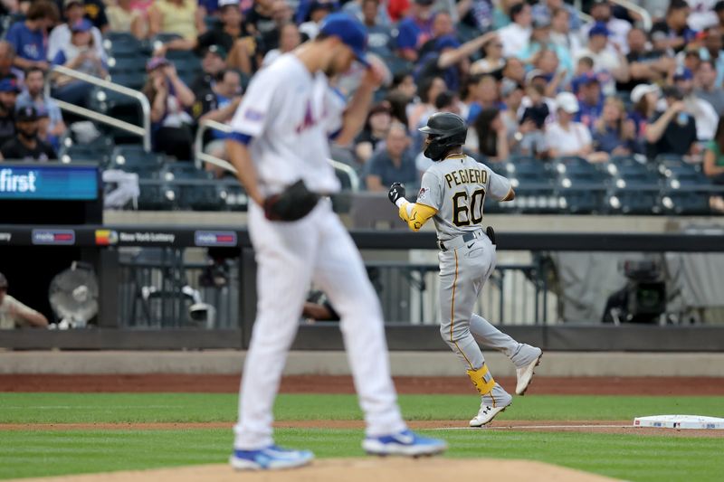 Aug 15, 2023; New York City, New York, USA; Pittsburgh Pirates shortstop Liover Peguero (60) rounds the bases after hitting a solo home run against New York Mets starting pitcher David Peterson (23) during the second inning at Citi Field. Mandatory Credit: Brad Penner-USA TODAY Sports