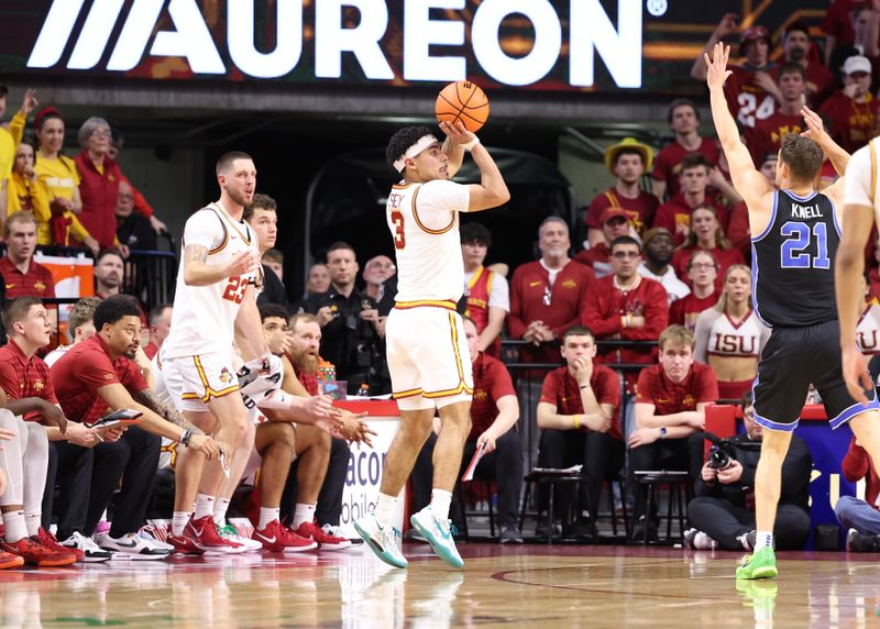 Mar 4, 2025; Ames, Iowa, USA; Iowa State Cyclones forward Conrad Hawley (23) watches Iowa State Cyclones guard Tamin Lipsey (3) shoot against the Brigham Young Cougars during the second half at James H. Hilton Coliseum. Mandatory Credit: Reese Strickland-Imagn Images