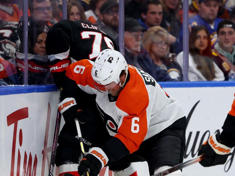 Nov 3, 2023; Buffalo, New York, USA;  Buffalo Sabres defenseman Connor Clifton (75) and Philadelphia Flyers defenseman Travis Sanheim (6) battle for a loose puck along the boards during the second period at KeyBank Center. Mandatory Credit: Timothy T. Ludwig-USA TODAY Sports