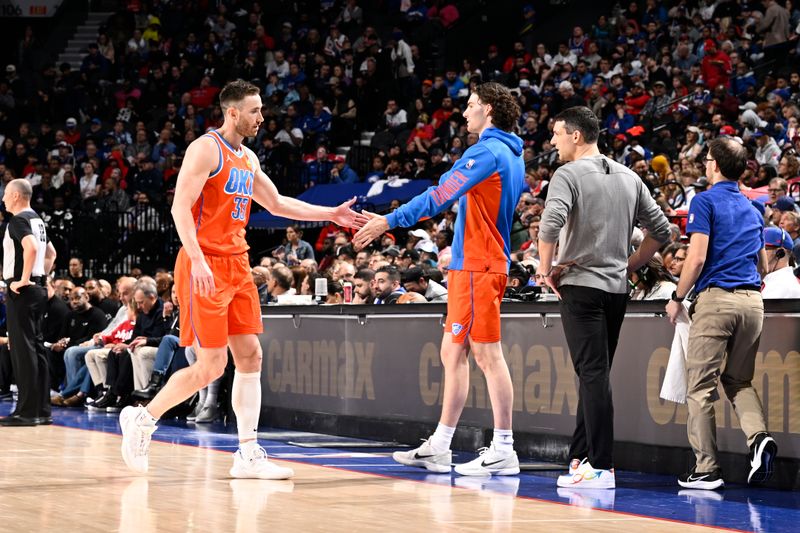 PHILADELPHIA, PA - APRIL 2: Gordon Hayward #33 of the Oklahoma City Thunder high fives Josh Giddey #3 of the Oklahoma City Thunder during the game against the Philadelphia 76ers on April 2, 2024 at the Wells Fargo Center in Philadelphia, Pennsylvania NOTE TO USER: User expressly acknowledges and agrees that, by downloading and/or using this Photograph, user is consenting to the terms and conditions of the Getty Images License Agreement. Mandatory Copyright Notice: Copyright 2024 NBAE (Photo by David Dow/NBAE via Getty Images)