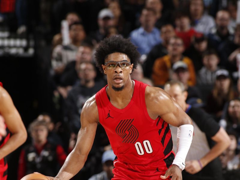 PORTLAND, OR - MARCH 23: Scoot Henderson #00 of the Portland Trail Blazers dribbles the ball during the game against the Denver Nuggets on March 23, 2024 at the Moda Center Arena in Portland, Oregon. NOTE TO USER: User expressly acknowledges and agrees that, by downloading and or using this photograph, user is consenting to the terms and conditions of the Getty Images License Agreement. Mandatory Copyright Notice: Copyright 2024 NBAE (Photo by Cameron Browne/NBAE via Getty Images)