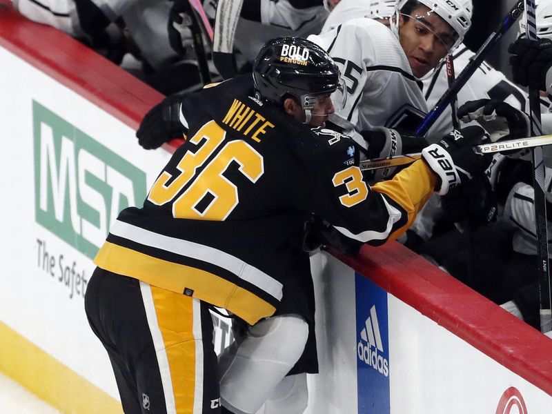 Feb 18, 2024; Pittsburgh, Pennsylvania, USA;  Pittsburgh Penguins center Colin White (36) checks Los Angeles Kings defenseman Quinton Byfield (55) during the second period at PPG Paints Arena. Mandatory Credit: Charles LeClaire-USA TODAY Sports