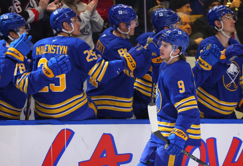 Nov 14, 2024; Buffalo, New York, USA;  Buffalo Sabres left wing Zach Benson (9) celebrates his goal with teammates during the first period against the St. Louis Blues at KeyBank Center. Mandatory Credit: Timothy T. Ludwig-Imagn Images