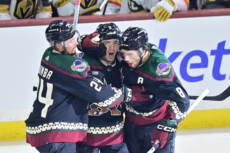 Feb 8, 2024; Tempe, Arizona, USA; Arizona Coyotes right wing Clayton Keller (9) celebrates with center Nick Schmaltz (8) and defenseman Matt Dumba (24) after scoring a goal in the third period against the Vegas Golden Knights at Mullett Arena. Mandatory Credit: Matt Kartozian-USA TODAY Sports