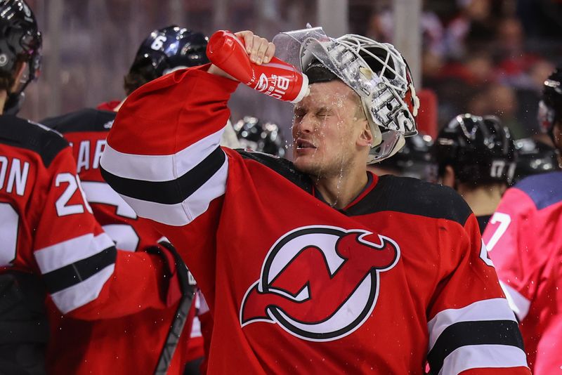 Feb 23, 2023; Newark, New Jersey, USA; New Jersey Devils goaltender Vitek Vanecek (41) sprays water on his face during a break in the first period against the Los Angeles Kings at Prudential Center. Mandatory Credit: Ed Mulholland-USA TODAY Sports