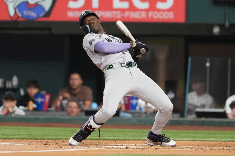 Sep 3, 2024; Arlington, Texas, USA; New York Yankees third baseman Jazz Chisholm Jr. (13) reacts to an inside pitch against the Texas Rangers during the second inning at Globe Life Field. Mandatory Credit: Jim Cowsert-Imagn Images