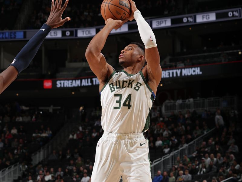 MILWAUKEE, WI - OCTOBER 20: Giannis Antetokounmpo #34 of the Milwaukee Bucks shoots the ball during the preseason game on October 20, 2023 at the Fiserv Forum Center in Milwaukee, Wisconsin. NOTE TO USER: User expressly acknowledges and agrees that, by downloading and or using this Photograph, user is consenting to the terms and conditions of the Getty Images License Agreement. Mandatory Copyright Notice: Copyright 2023 NBAE (Photo by Gary Dineen/NBAE via Getty Images).