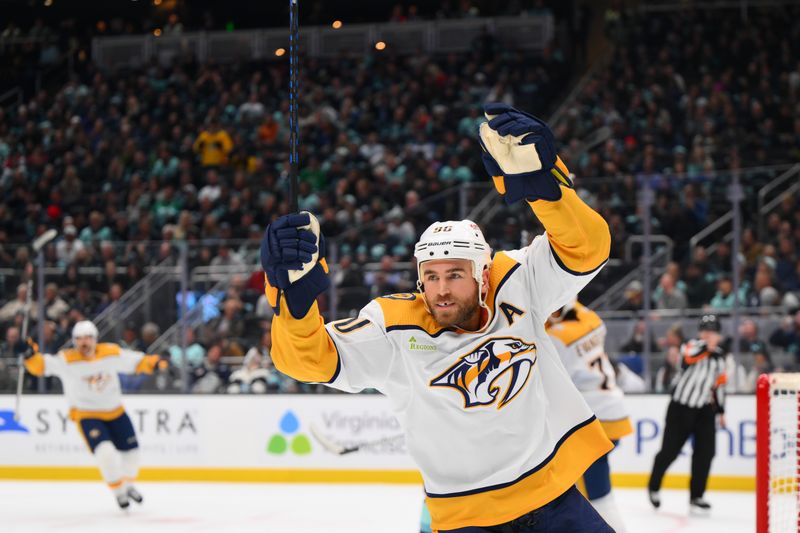 Nov 2, 2023; Seattle, Washington, USA; Nashville Predators center Ryan O'Reilly (90) celebrates a goal scored by defenseman Roman Josi (not pictured) during the second period at Climate Pledge Arena. Mandatory Credit: Steven Bisig-USA TODAY Sports